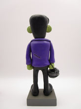 Halloween folk art Frankenstein character with mummy bucket