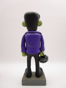 Halloween folk art Frankenstein character with mummy bucket