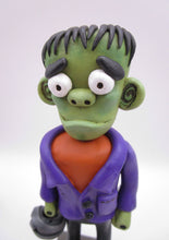 Halloween folk art Frankenstein character with mummy bucket