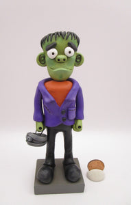 Halloween folk art Frankenstein character with mummy bucket