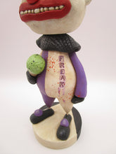 Halloween folk art creepy clown named "freak" with ice cream cone