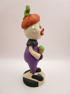 Halloween folk art creepy clown named "freak" with ice cream cone