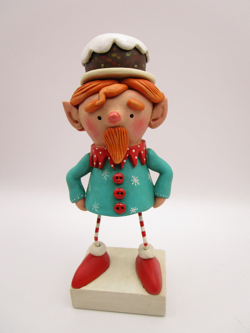 Christmas folk art ELF character with fruitcake platter on his head