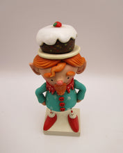 Christmas folk art ELF character with fruitcake platter on his head