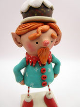 Christmas folk art ELF character with fruitcake platter on his head