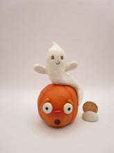 Halloween folk art cute ghost sitting on surprised pumpkin
