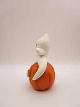 Halloween folk art cute ghost sitting on surprised pumpkin