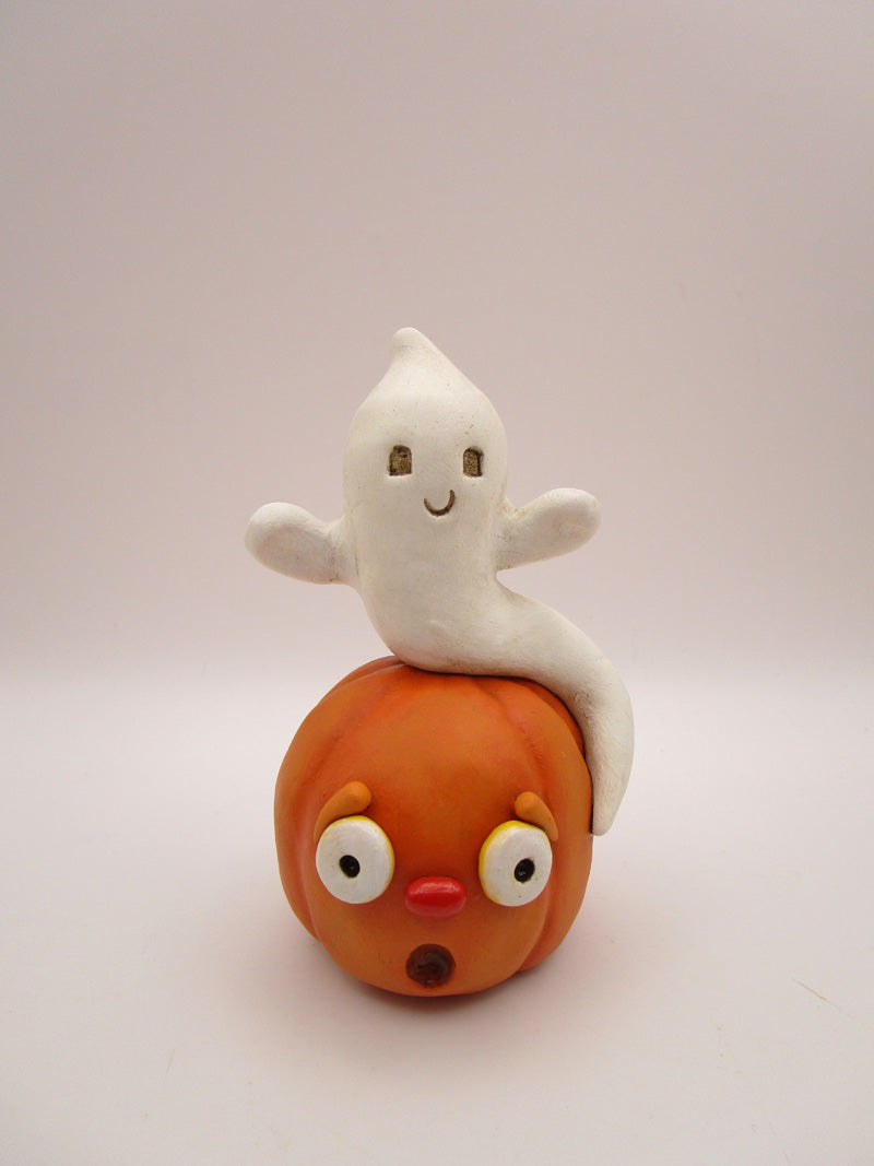 Halloween folk art cute ghost sitting on surprised pumpkin