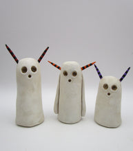 Halloween folk art spooky ghost with purple and black horns