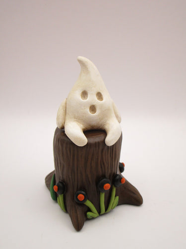 Halloween folk art little ghost sitting on stump