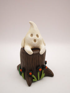 Halloween folk art little ghost sitting on stump