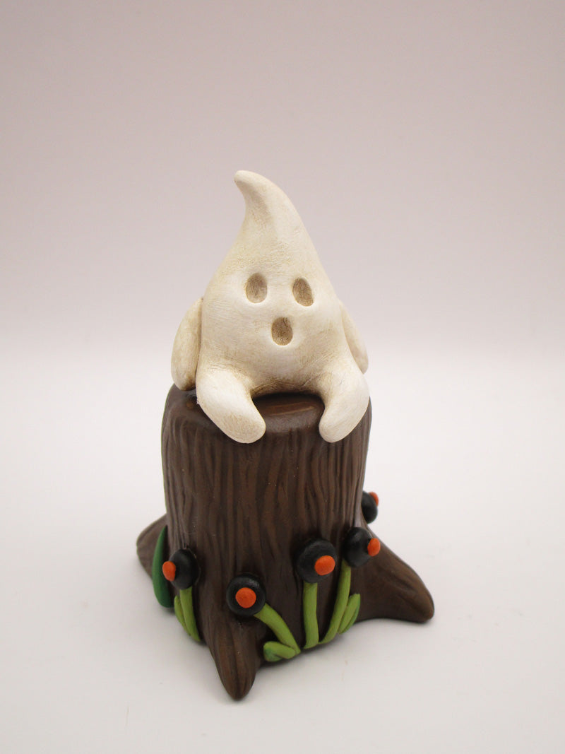 Halloween folk art little ghost sitting on stump