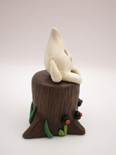 Halloween folk art little ghost sitting on stump