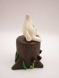 Halloween folk art little ghost sitting on stump