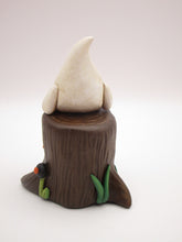 Halloween folk art little ghost sitting on stump