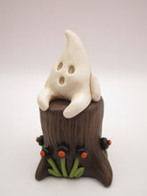 Halloween folk art little ghost sitting on stump
