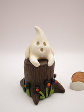 Halloween folk art little ghost sitting on stump