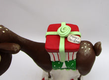Christmas folk art REINDEER carrying gift - one of a kind, signed