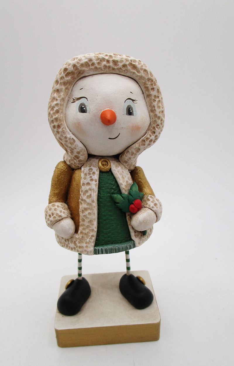 Christmas snowman wearing golden shimmer jacket holding holly sprig