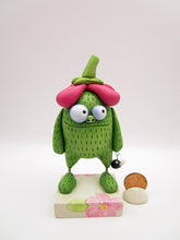 Spring folk art green monster with big flower top