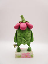 Spring folk art green monster with big flower top