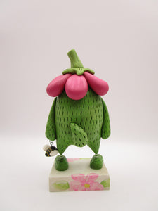 Spring folk art green monster with big flower top