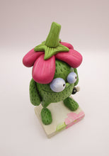Spring folk art green monster with big flower top
