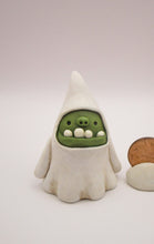 Halloween folk art green monster ghost with wacky teeth