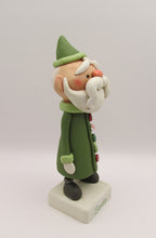 Christmas folk art Santa Claus with long buttoned up jacket