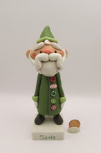 Christmas folk art Santa Claus with long buttoned up jacket