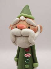 Christmas folk art Santa Claus with long buttoned up jacket