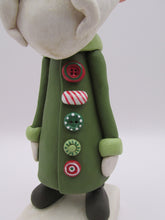 Christmas folk art Santa Claus with long buttoned up jacket