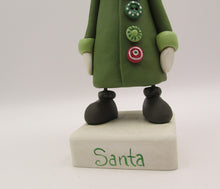 Christmas folk art Santa Claus with long buttoned up jacket