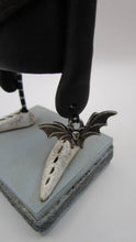 Halloween folk art "gunny sack" texture with lots of buttons and bat charm
