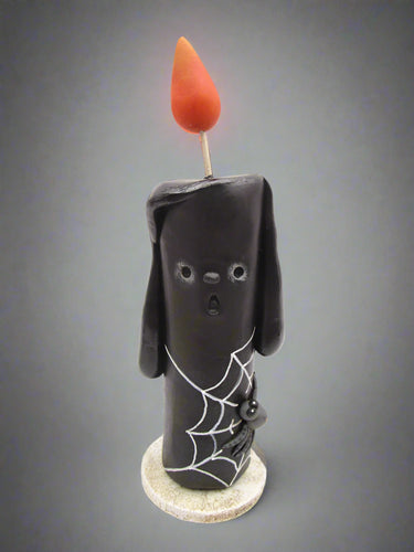 Halloween folk art black candle with spider