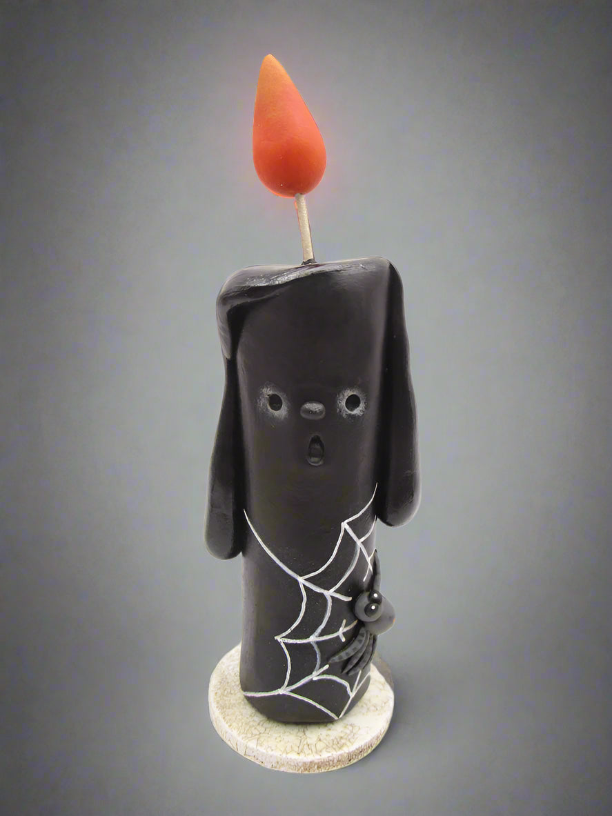 Halloween folk art black candle with spider