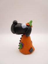 Halloween folk art Dog wearing a pumpkin "patch" costume