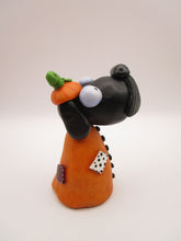 Halloween folk art Dog wearing a pumpkin "patch" costume
