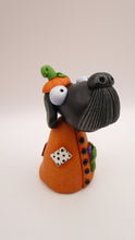 Halloween folk art Dog wearing a pumpkin "patch" costume