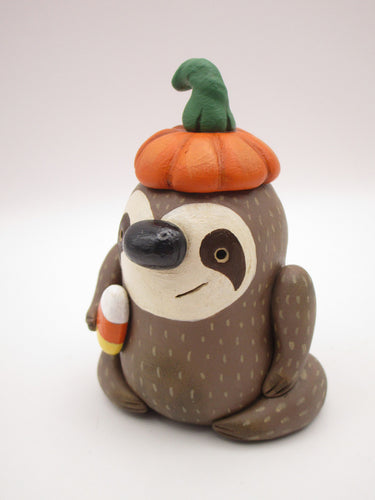 Halloween folk art sloth wearing pumpkin hat