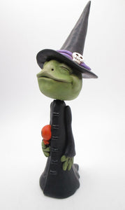 Halloween FROG dressed in witch costume with candy treat