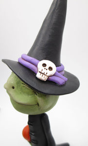 Halloween FROG dressed in witch costume with candy treat