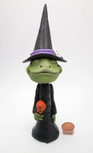 Halloween FROG dressed in witch costume with candy treat