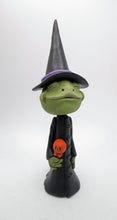 Halloween FROG dressed in witch costume with candy treat