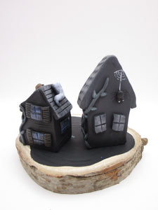 Halloween spooky scene with spooky houses on wood