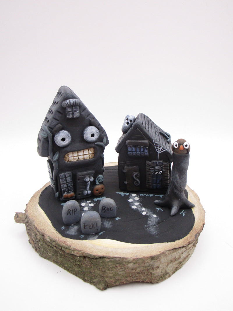 Halloween spooky scene with spooky houses on wood