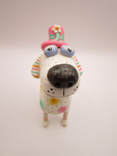 Summer folk art dog with pastel spots and silly floral hat