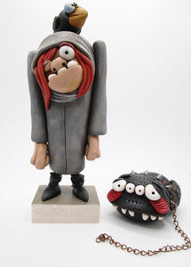 Halloween Igor Hunchback character with big pet spider on copper chain