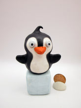 Christmas folk art penguin on block of "ice"