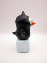 Christmas folk art penguin on block of "ice"